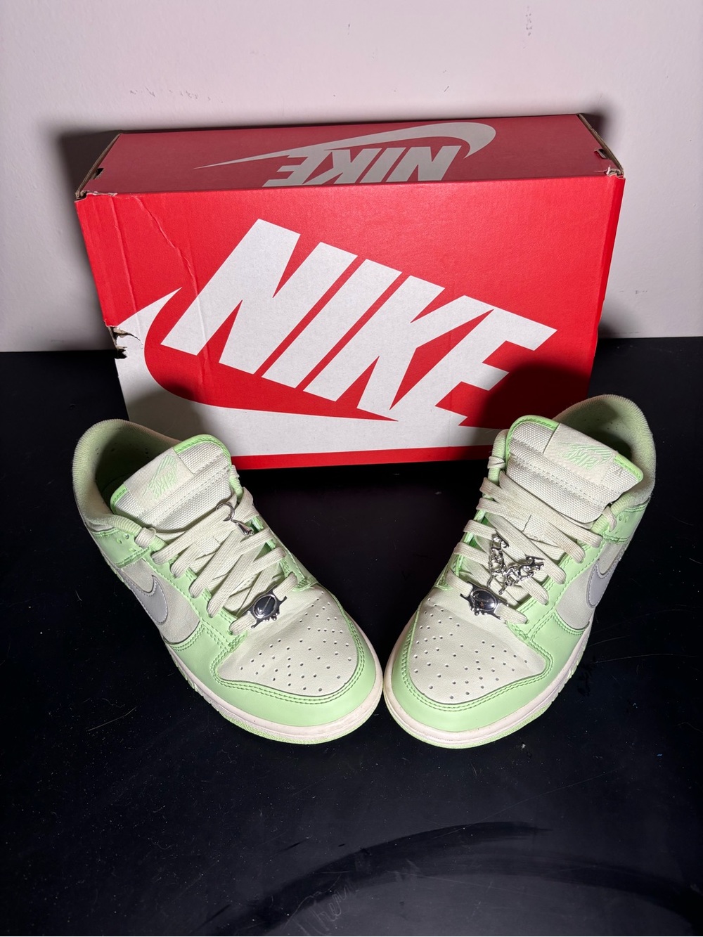 Nike Low-Top Sneakers in Light Green and Cream with Silver Swoosh